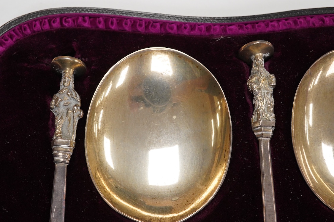 A late Victorian cased set of four silver apostle serving spoons, by Wakely & Wheeler, London, 1890, 19.6cm, 6.5oz.